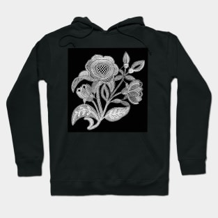 embroidery image with fabric and threads forming a stylized black and white flower branch Hoodie